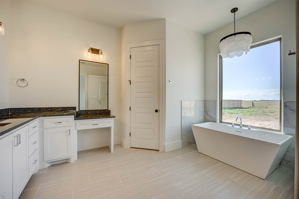 Amazing master bath, with special window and isolated stand-alone bathtub, in beautiful new home for sale in Lubbock.