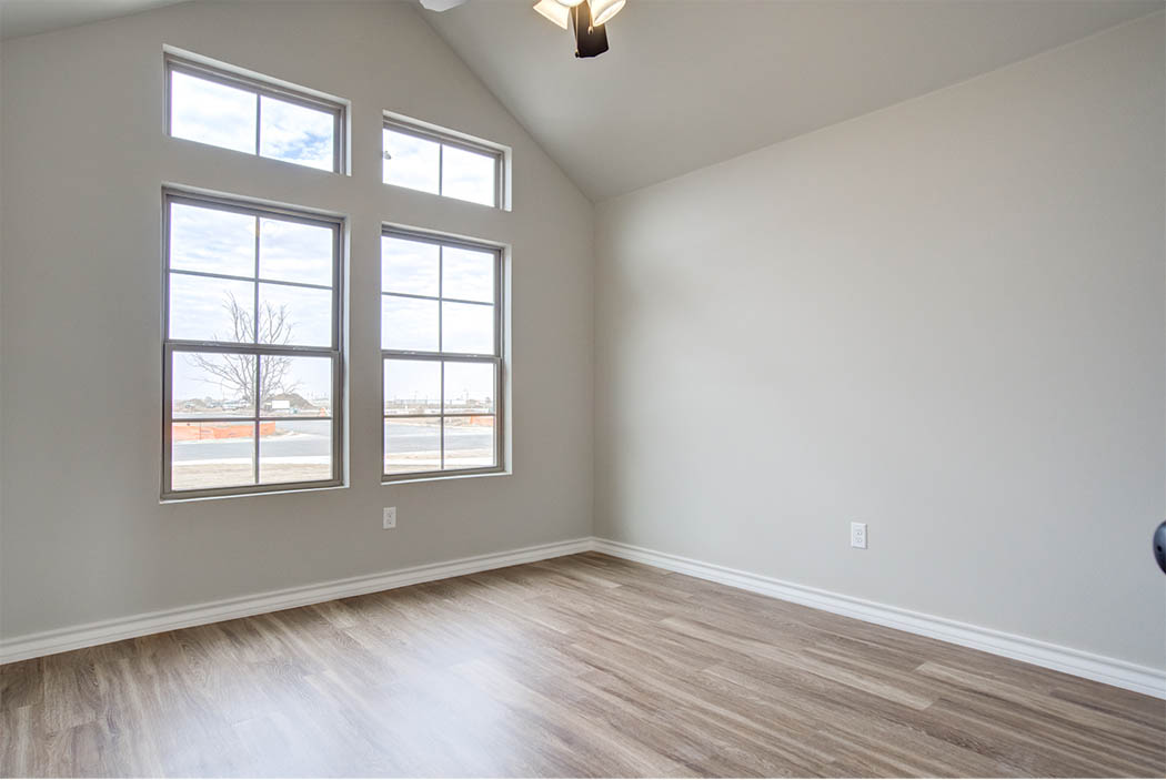 Spacious bedroom or office area in new home for sale in Lubbock.