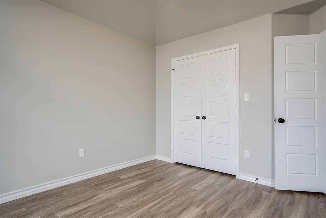 Spacious bedroom or office area in new home for sale in Lubbock.