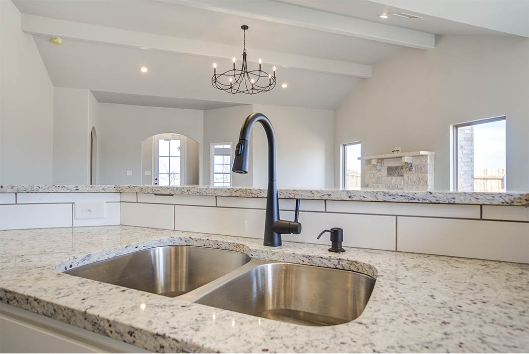 Detail of kitchen sink island in new home for sale in Lubbock.