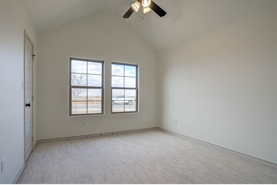 Bedroom with vaulted ceiling in new home for sale in Lubbock.