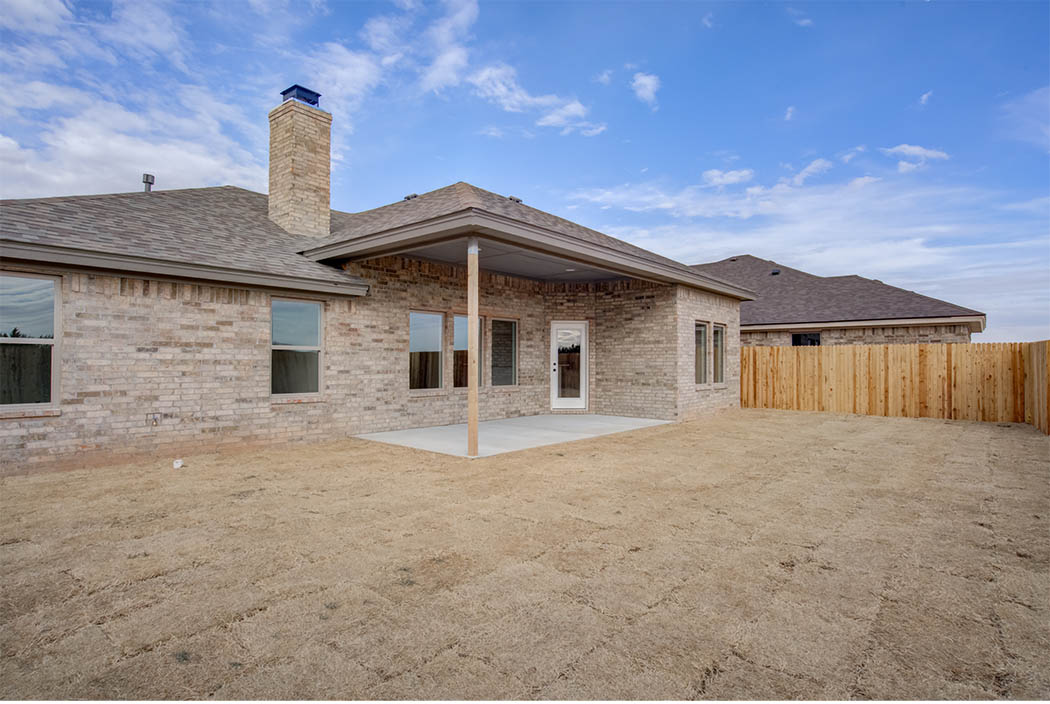 Back patio of beautiful new Lubbock home for sale by Sharkey Custom Homes.