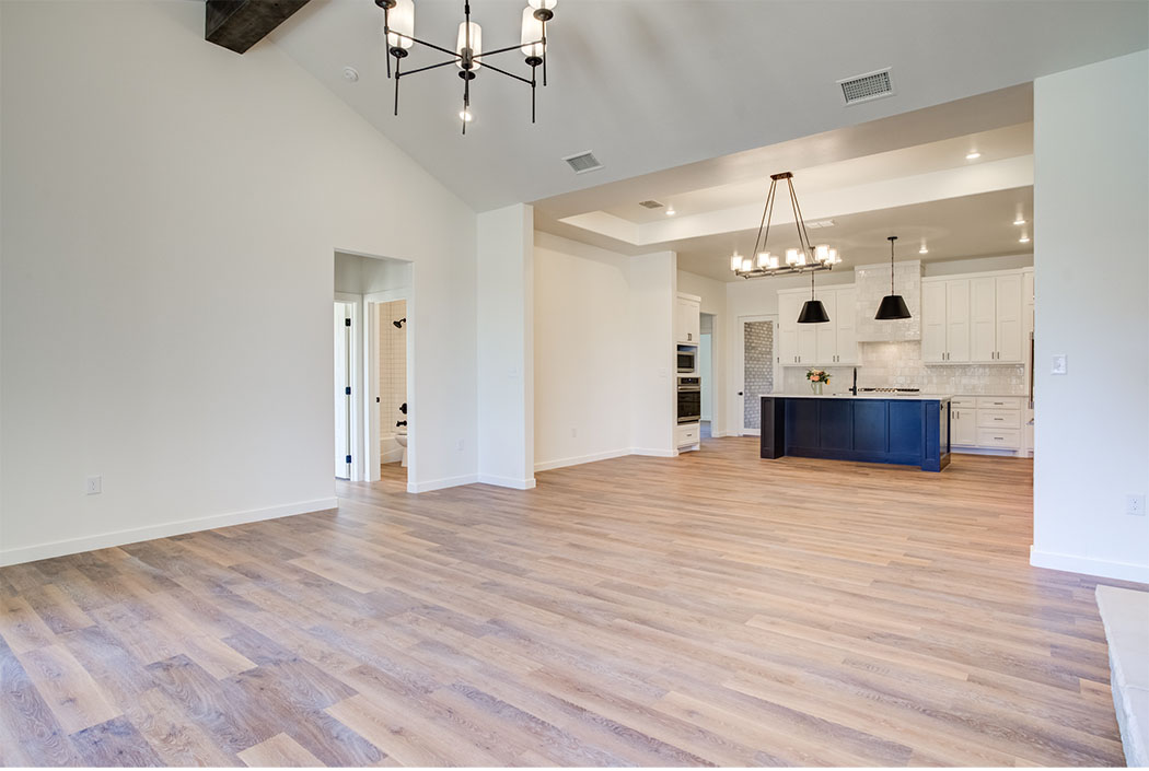 Long view of open space living area in new Lubbock home.