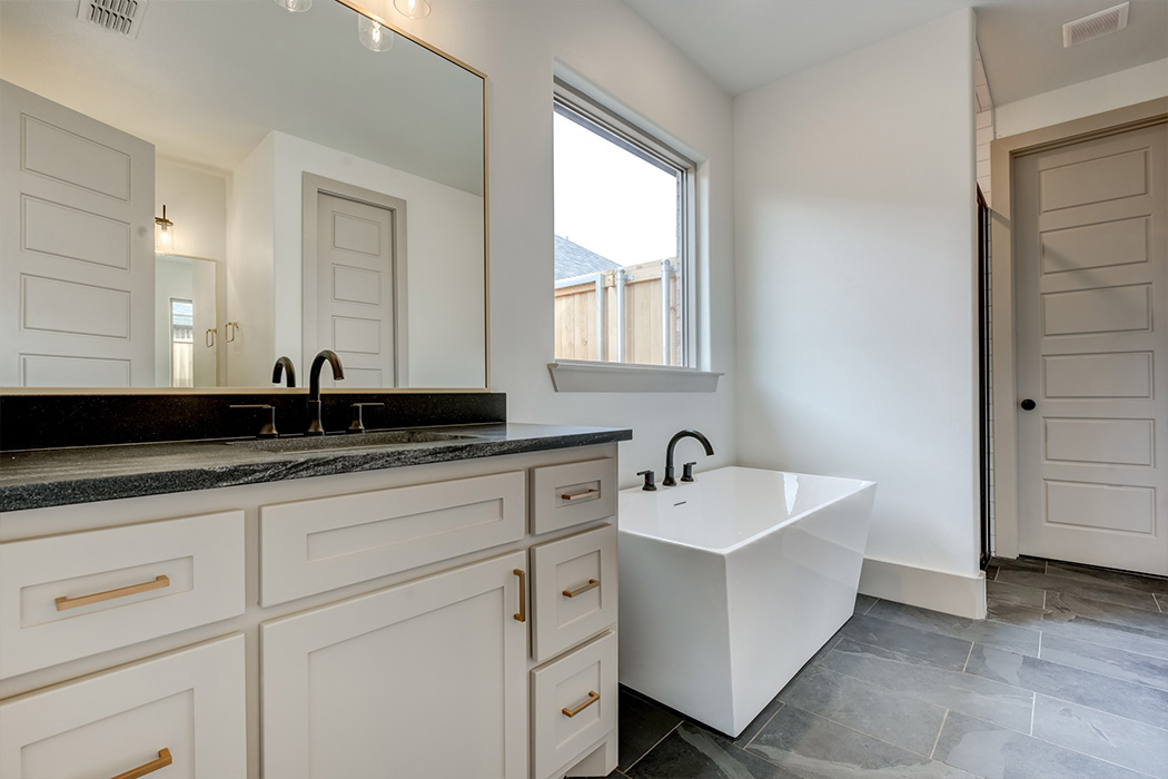 Vanity in amazing master bath, with isolated stand-alone bathtub, in beautiful new home for sale in Lubbock.