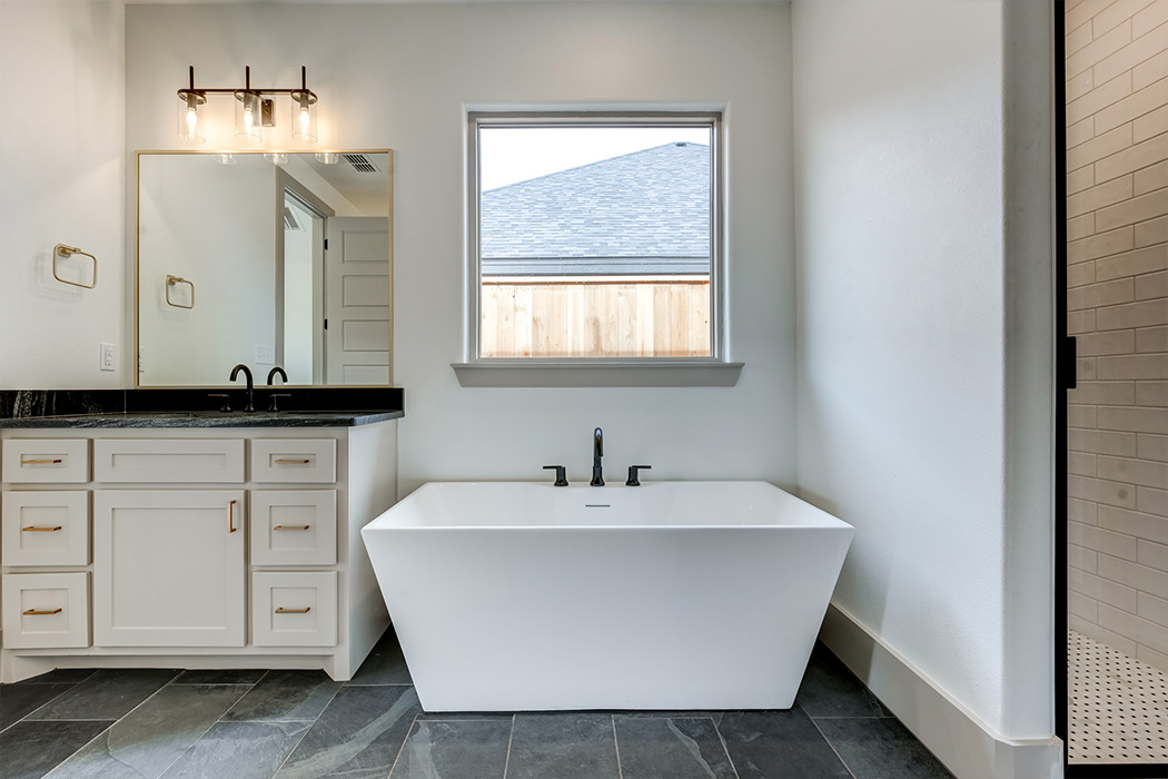 Isolated free-standing specialty bath tub in beautiful master bath.