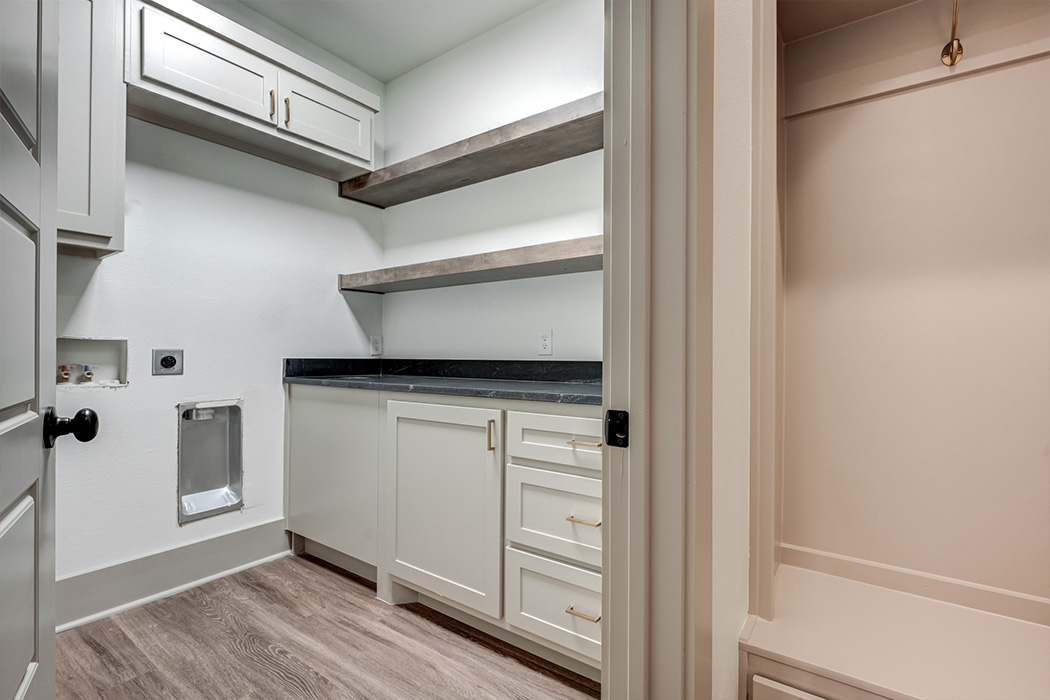 View of spacious laundry room with plenty of counterspace in new Lubbock home.