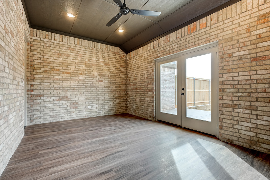 Alternate view of versatle bonus room or office, with brick walls in new home for sale in Lubbock.