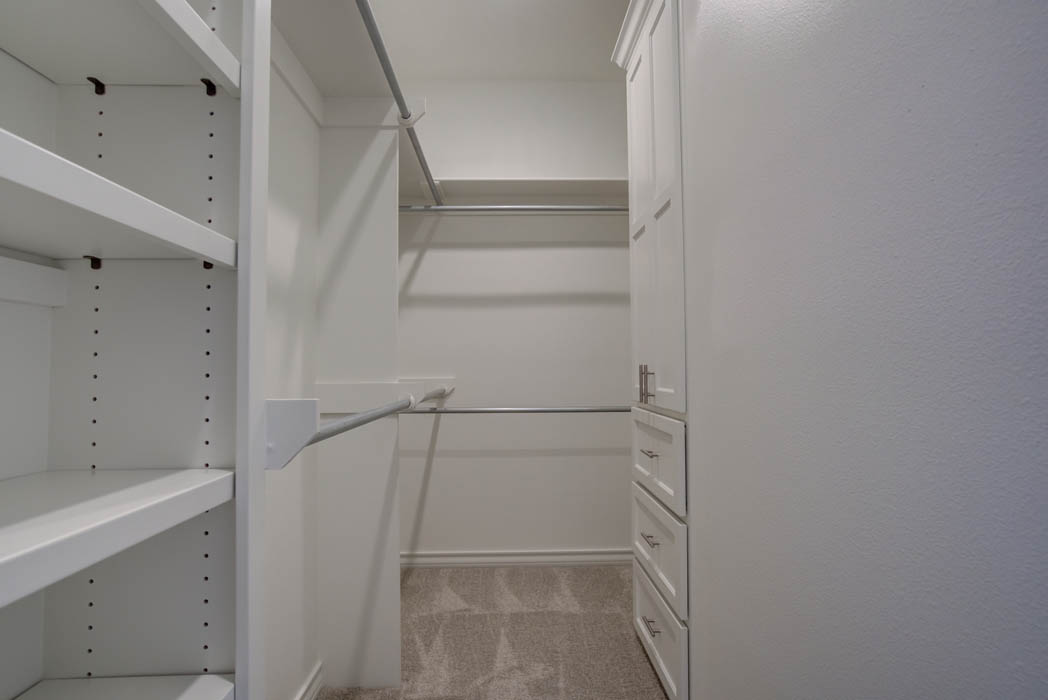 Spacious master closet in new home for sale by Sharkey Custom Homes.