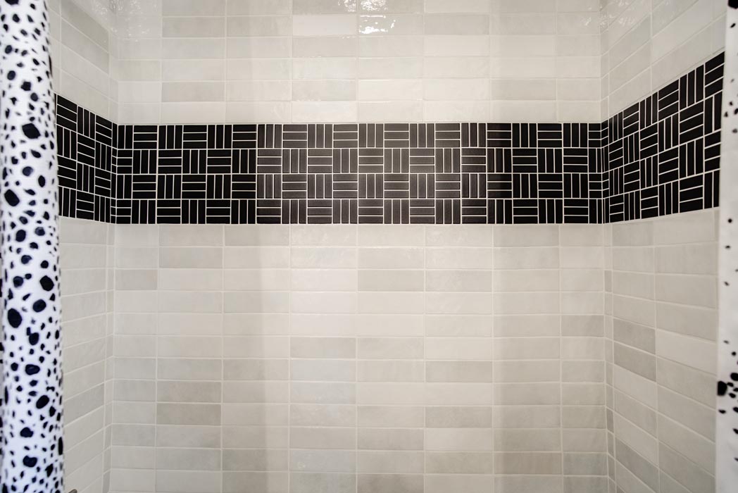 Detail of shower tile work in guest bath in new Lubbock home.