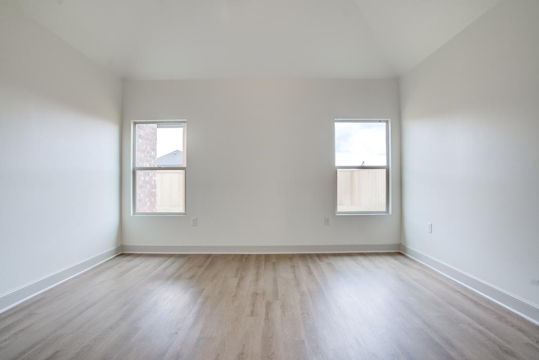 Windows in spacious bedroom of new home for sale in Lubbock, Texas.