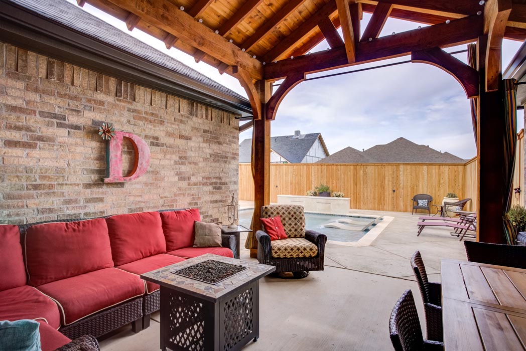 Spacious covered outdoor patio and sitting area in new home for sale in West Texas.