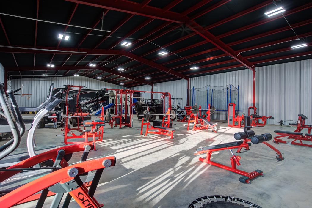 Example workout-exercise gym in beautiful new home built by Sharkey Custom Homes in Lubbock, Texas.