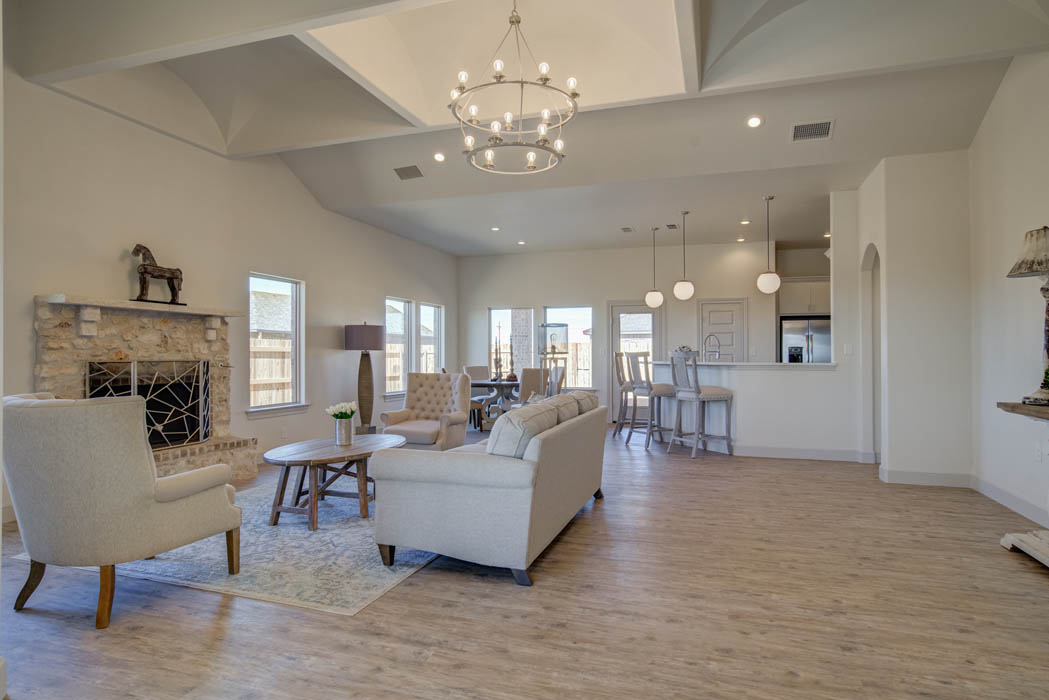 Spacious living area with wonderful details in home by Sharkey Custom Homes.