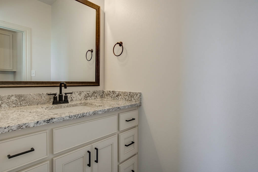 Beautiful guest bathroom in new home by Sharkey Custom Homes in Lubbock, Texas.