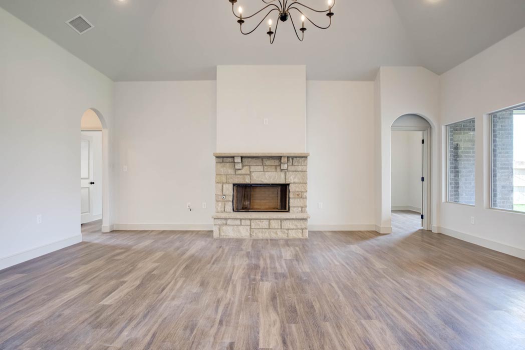 Spacious living area and great room in new home for sale in Lubbock, Texas with vaulted ceiling.