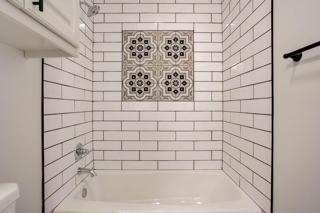 Detail of shower tile in bath of beautiful new home for sale in Lubbock, Texas.