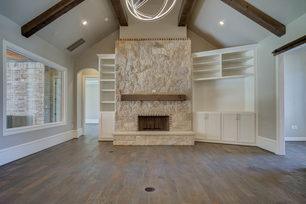Fireplace in living area in beautiful custom home by Sharkey Custom Homes, near Lubbock, Texas.