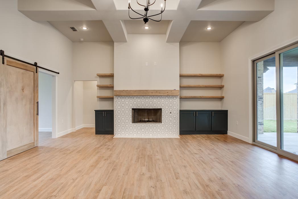 Large, open living area with beautiful wood floors in new Lubbock home for sale.