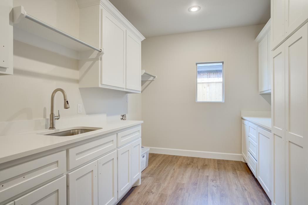 Spacious laundry-mud room in new home built by Sharkey Custom Homes in Lubbock, Texas.