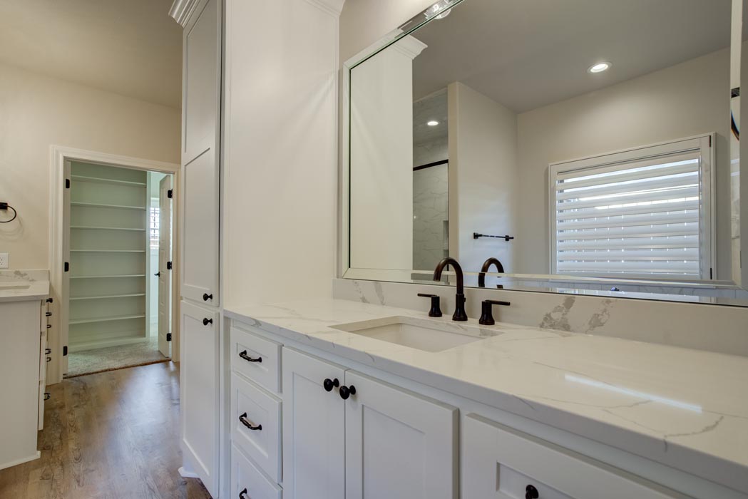 View of vanity & mirror in large, luxurious master bath.