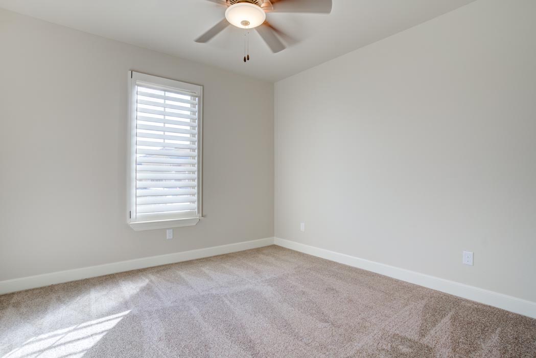 Angle view of spacious bedroom in new Lubbock home for sale.
