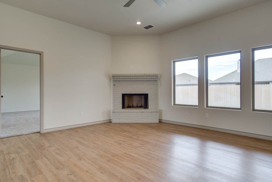 Fireplace in living area in new home for sale in Lubbock, Texas.