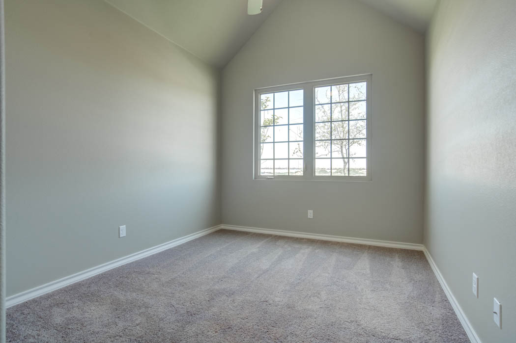 Spacious bedroom in Lubbock area home for sale.