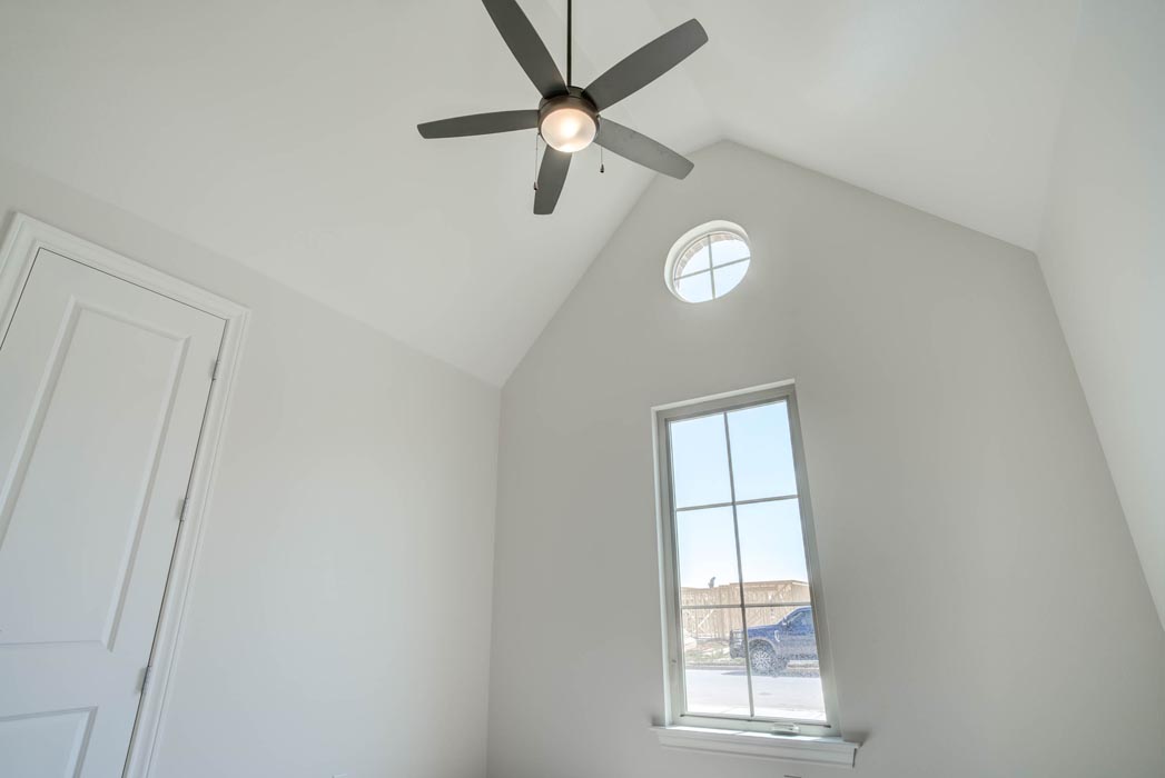 Beautiful spacious bedroom with vaulted ceiling in new home for sale in Lubbock.
