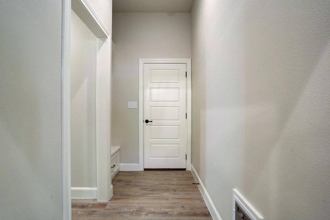 Entry to laundry and mud room areas of new house for sale in Lubbock, Texas.