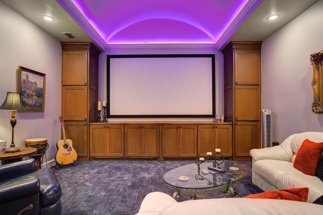 Spacious home theatre room with amazing mood lighting, in Lubbock custom home.