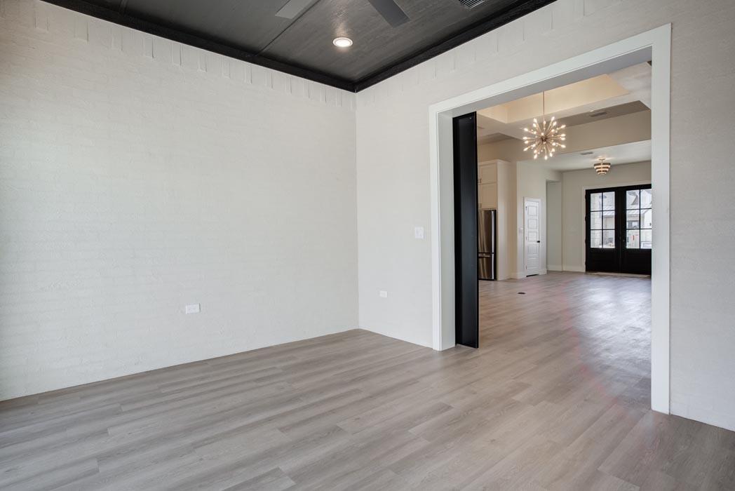 Alternate view of versatle bonus room or office, with brick walls in new home for sale in Lubbock.