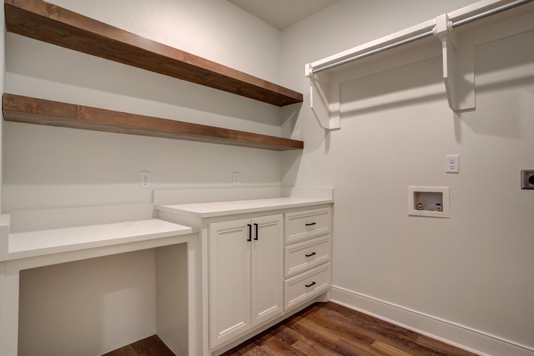 Example of spacious laundry-mud room in new home built by Sharkey Custom Homes in Lubbock, Texas.