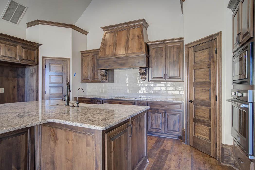 Photograph of spacious kitchen in custom home in Lubbock, Texas.