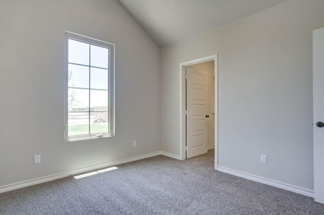 Guest bedroom in beautiful new home for sale in Lubbock.