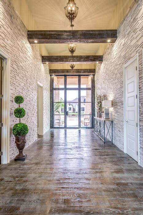 Beautiful entry with detailed doors in Lubbock, Texas home.